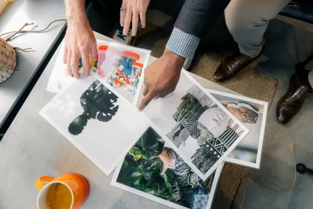 Workshop participants exploring a collage of photographs